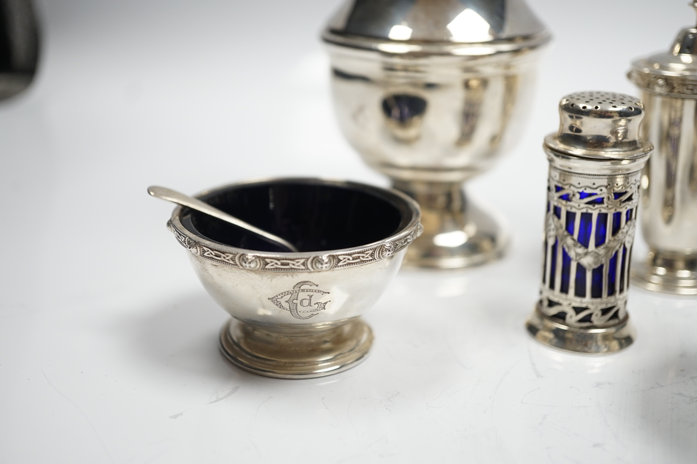 A modern silver baluster sugar caster by Elkington & Co and four assorted silver condiments.